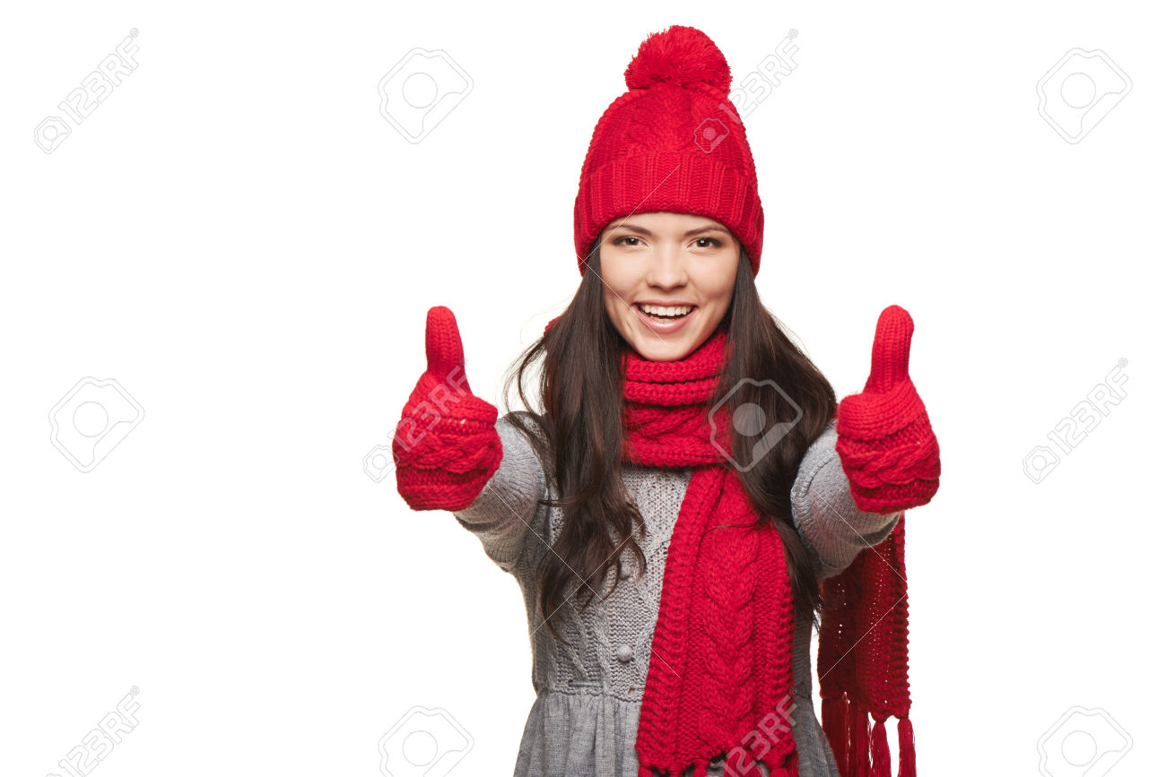 33991794-Closeup-of-happy-woman-wearing-red-warm-winter-hat-scarf-and-gloves-giving-you-double-thumb-up-over--Stock-Photo.jpg