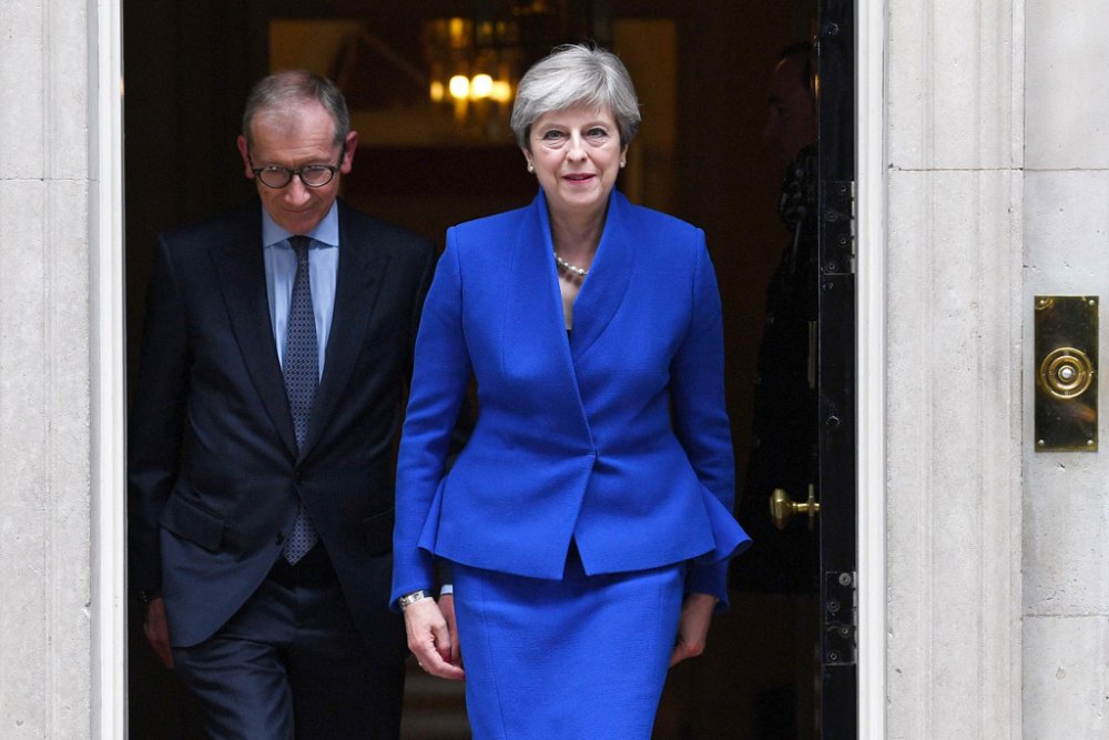 Theresa May Makes Statement in Blue Suit & Snake-Print Heels ...