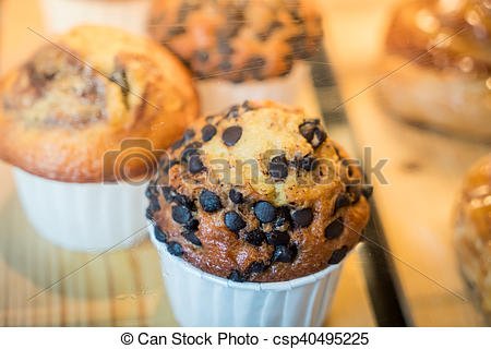 Brightly colored cakes in refrigerator . Brightly colored cakes in ...