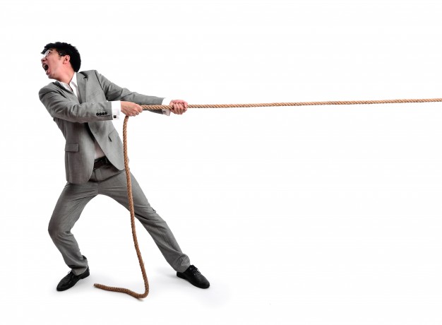 business-man-pulling-on-a-rope_1112-381.