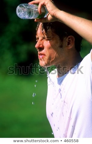 man-pouring-water-over-face-450w-460558.