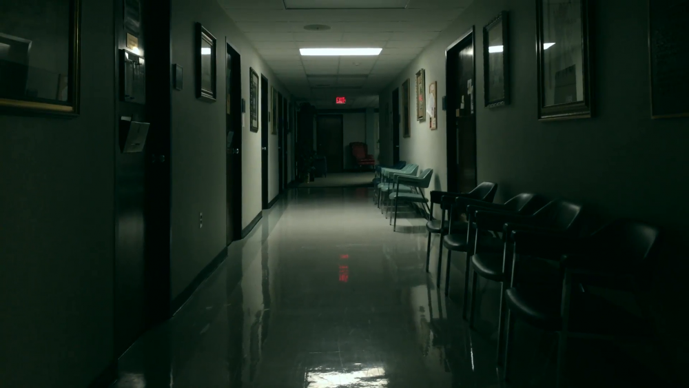 man-running-in-fear-down-a-dark-hallway_